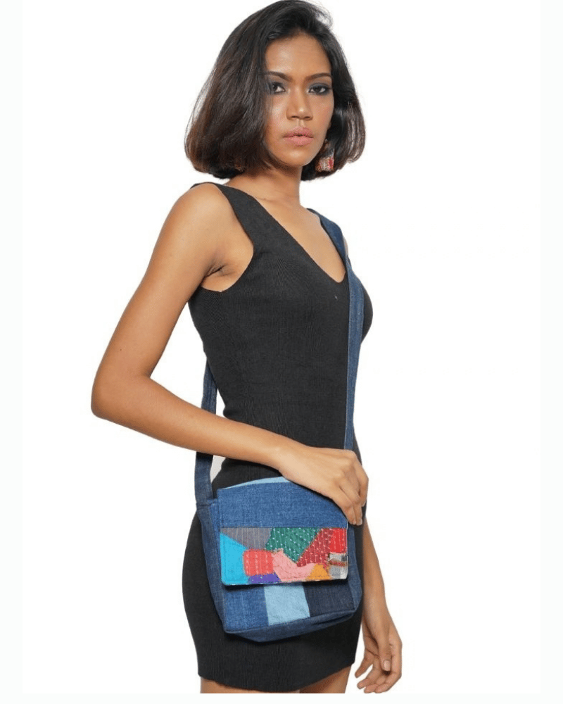 Woman carrying a Classy Denim Sling Bag with upcycled denim patchwork