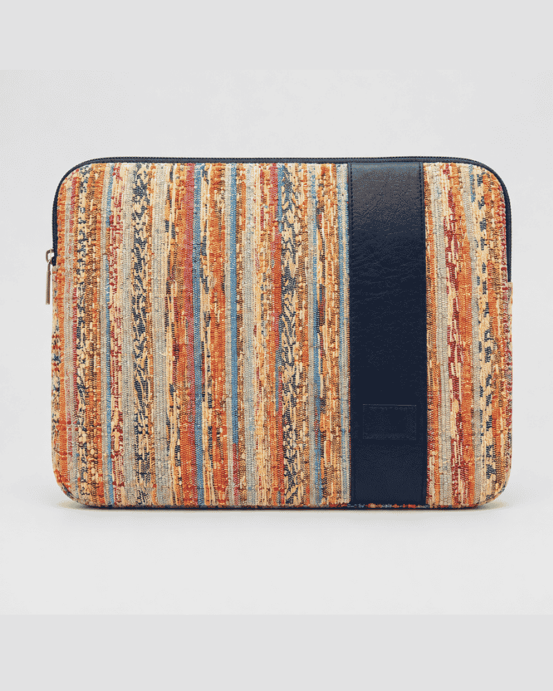 Side view of Kora laptop sleeve with upcycled textile patchwork design