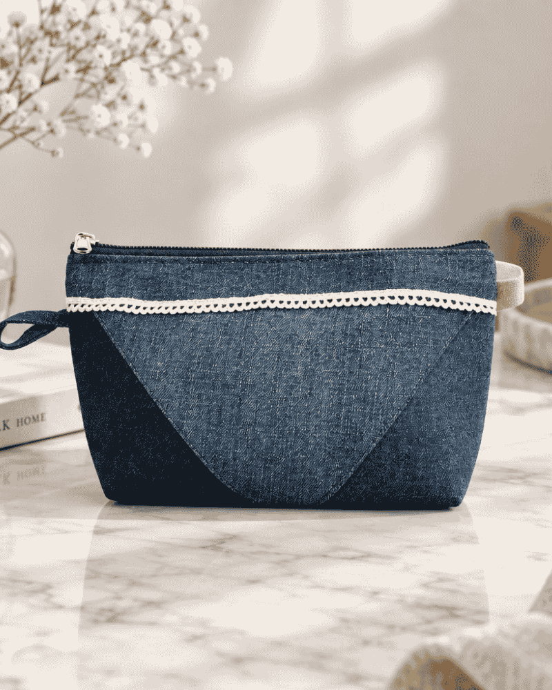 Blue denim utility pouch with zipper and side loop