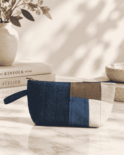Blue denim utility pouch with contrasting patchwork design
