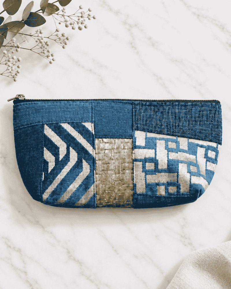 Blue denim utility pouch with white patterned detailing
