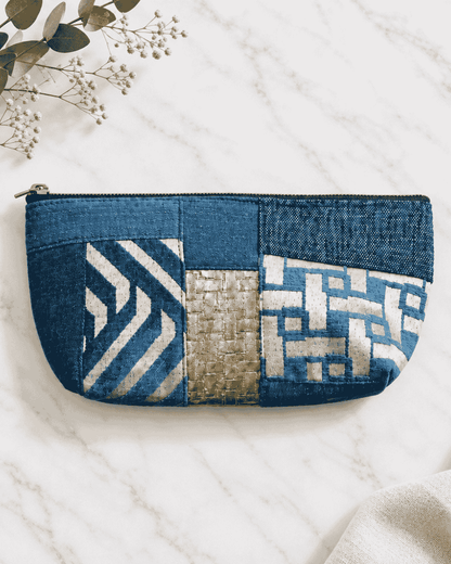 Blue denim utility pouch with white patterned detailing
