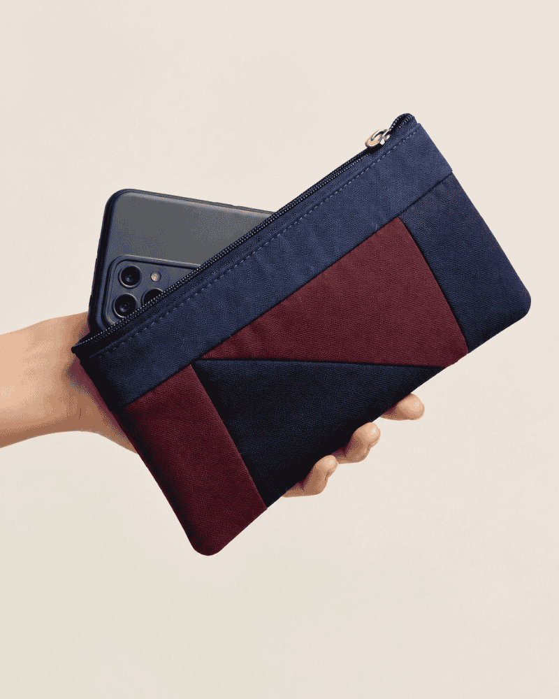 Close-up of blue and dark patchwork minimalist pouch