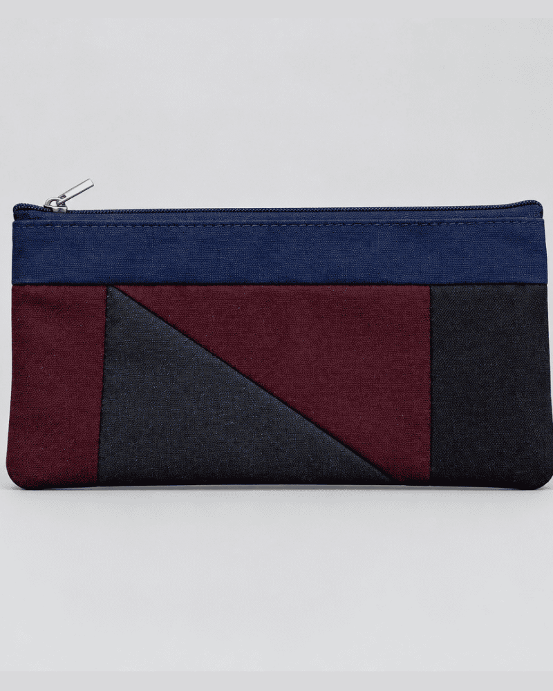 Modern blue and dark patchwork pouch shown flat
