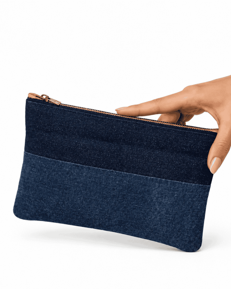 Blue and dark patchwork pouch held in hand
