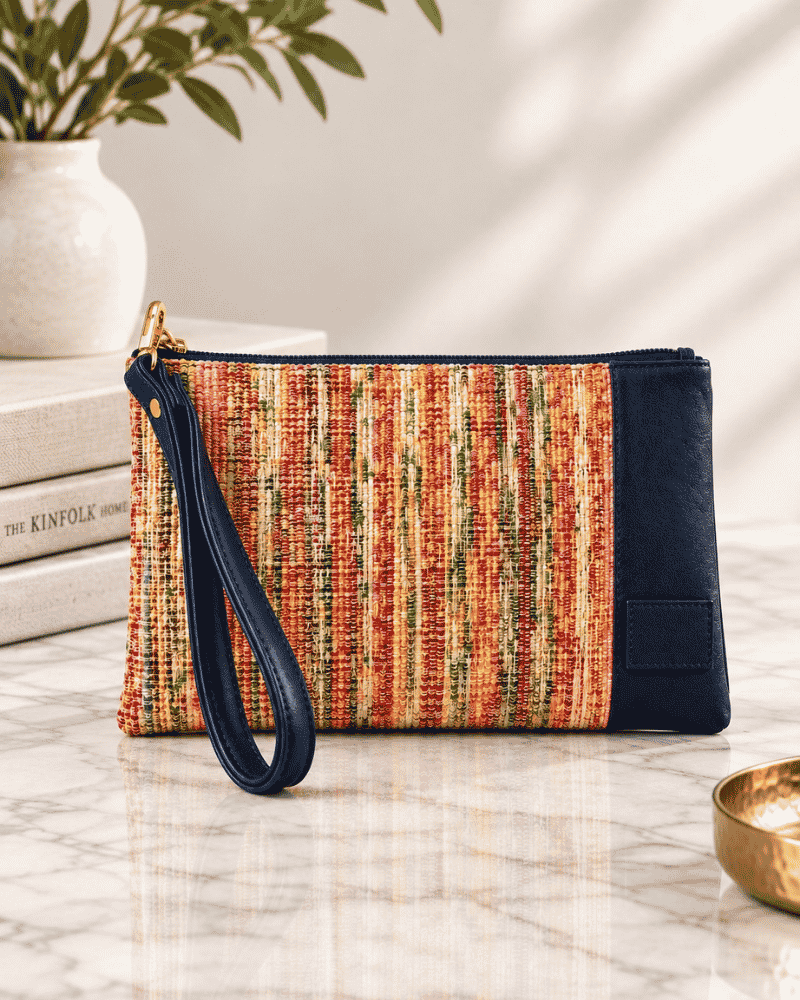 Rang Woven Clutch with multicolour woven front, navy blue side panel and wristlet strap
