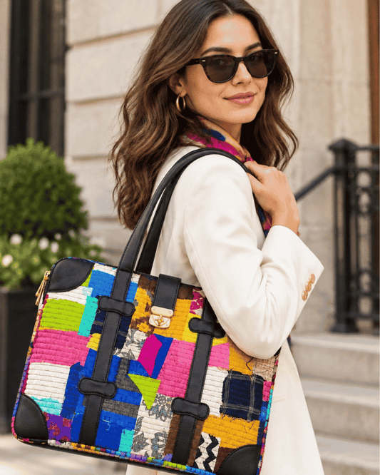 Woman carrying a multicolor Repatch Laptop Bag made from upcycled fabric
