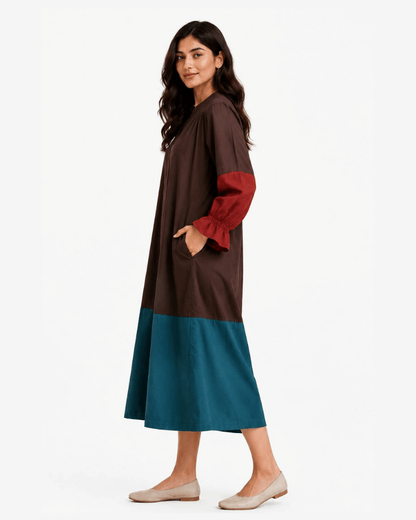 Front view of brown and teal colour block dress with contrasting rust-red sleeves