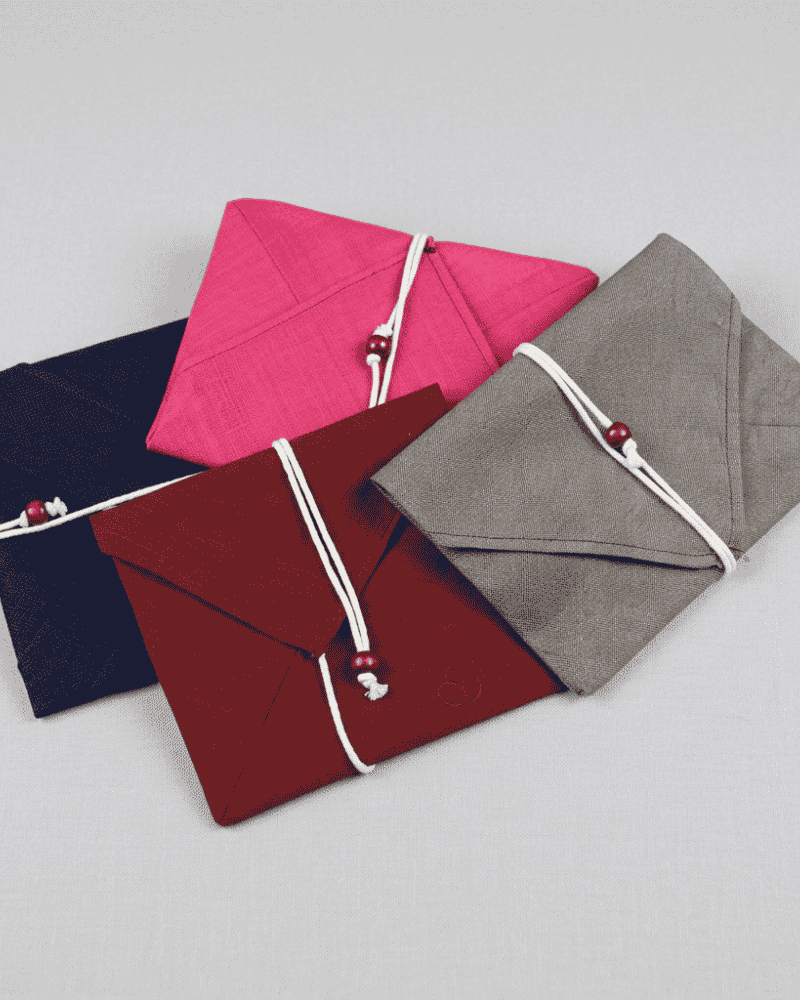 Fabric envelopes in pink, navy, grey and burgundy