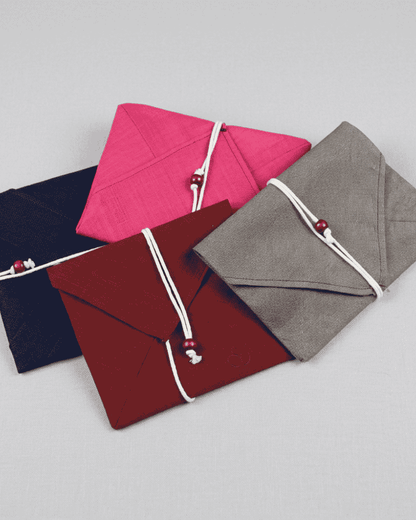 Fabric envelopes in pink, navy, grey and burgundy