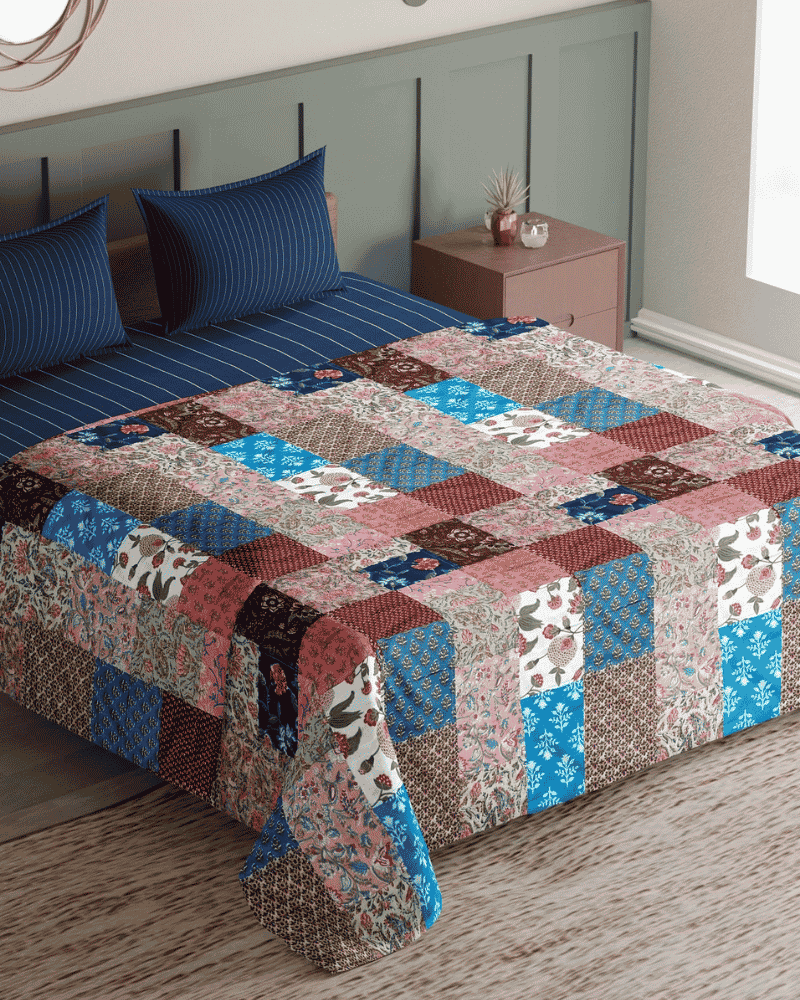 Ethnic Charm upcycled patchwork bed spread styled on a bed