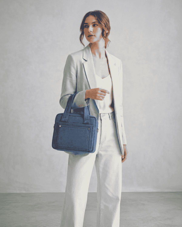 Woman carrying Nila denim handbag made from upcycled denim