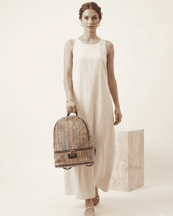 Woman carrying a Reva woven backpack made from upcycled textiles
