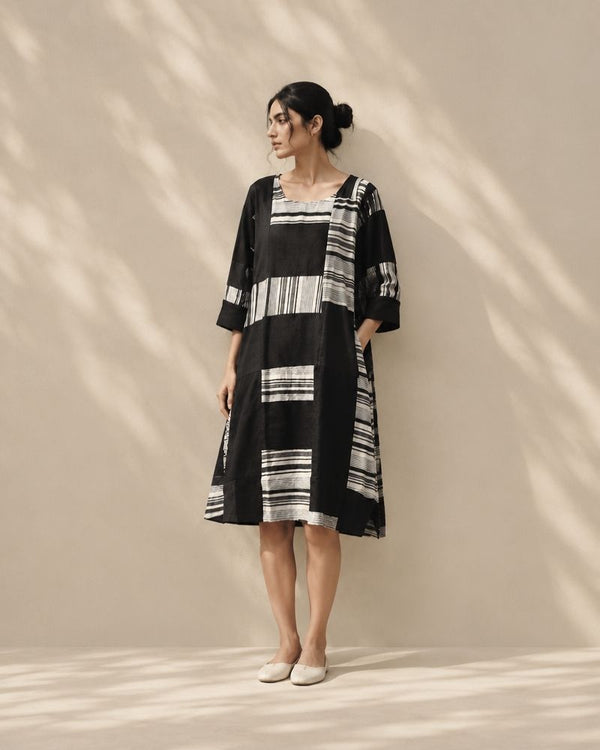 Riva black and white patchwork dress with striped textile panels and three quarter sleeves