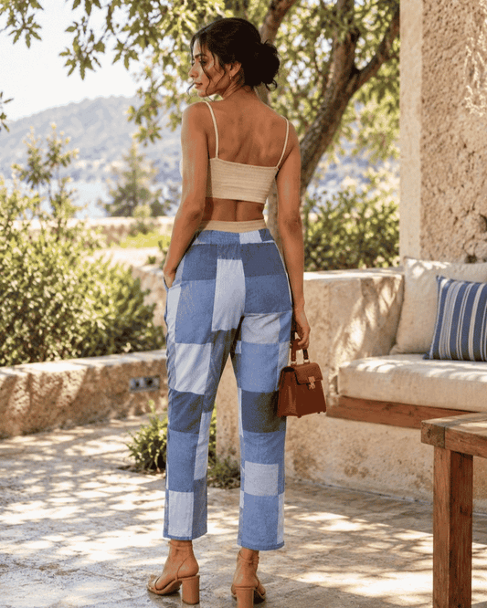 Woman wearing blue and grey parallel pants made from upcycled textile offcuts