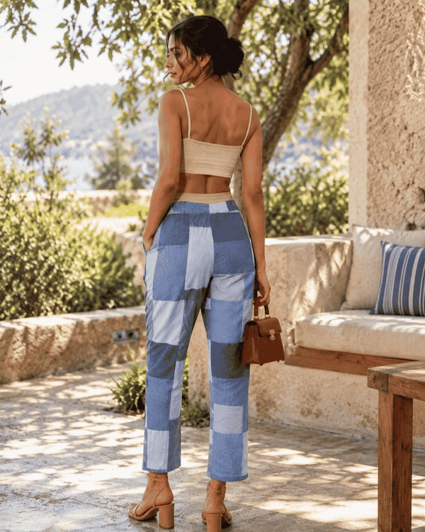 Woman wearing blue and grey parallel pants made from upcycled textile offcuts