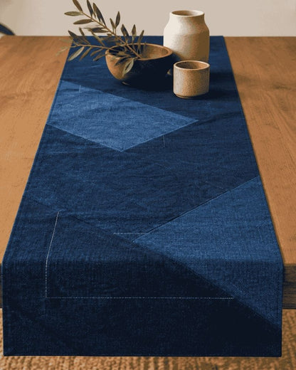 Dark and light blue geometric patchwork table runner styled with ceramics on a wooden table, Bunko Junko.