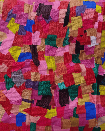 Pink upcycled textile scrap fabric panel featuring multicolour geometric fabric pieces.

